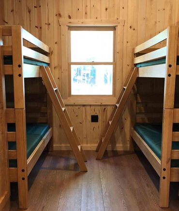 bunk beds inside of camper cabin